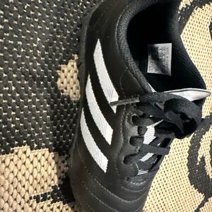 Boys adidas cleat used black and white